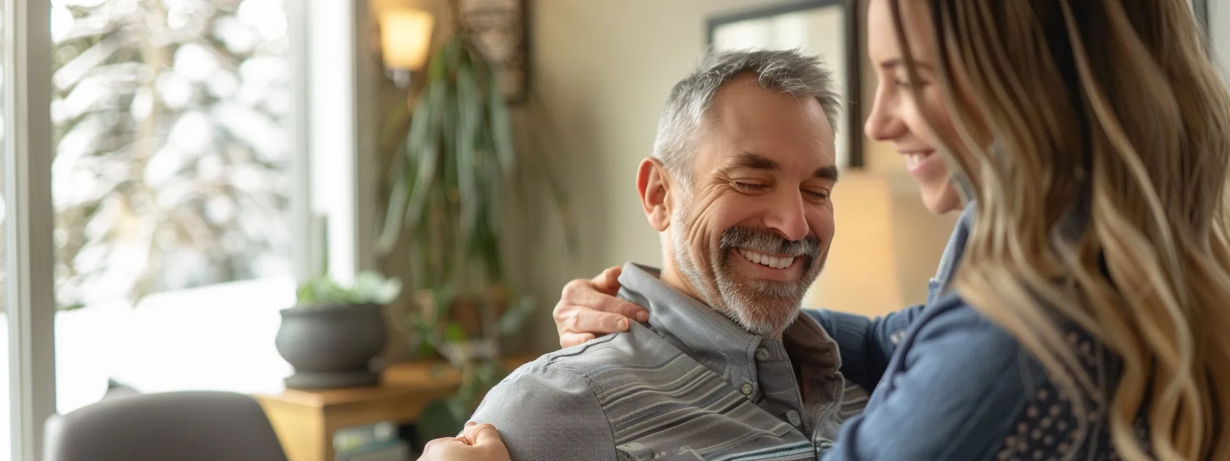 a smiling chiropractor adjusting a patient's spine in a cozy clinic in cochrane.