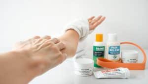 A close-up view of a human forearm with tendons visible, showcasing various pain management techniques. In the foreground, fingers gently massaging the tender areas, applying pressure and kneading motions. In the middle ground, a hot compress is being applied, with steam rising against a clean, clinical backdrop. The lighting is soft and diffused, creating a soothing, therapeutic atmosphere. In the background, a selection of pain relief creams, ointments, and a resistance band used for gentle stretching exercises are neatly arranged, conveying a comprehensive approach to tendon pain management.