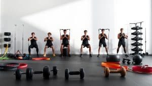 A well-lit, high-contrast studio photograph of a set of progressive loading exercises designed for tendon rehabilitation. The foreground features various resistance bands, dumbbells, and other workout equipment arranged in a visually appealing composition. The middle ground showcases a clear, step-by-step sequence of exercises, each demonstrating a gradual increase in load and intensity. The background is a clean, minimalist space with soft shadows and subtle gradients, allowing the exercises to be the primary focus. The overall atmosphere conveys a sense of professionalism, functionality, and attention to detail, reflecting the optimized rehabilitation approach described in the article.